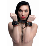 Lock up your slave in this attractive and unique collar to wrist restraint set.