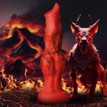The smooth skin of this red hot shaft is accented by smokey black lines. Near the base are four bulging knots from a very hard Fire Hound!